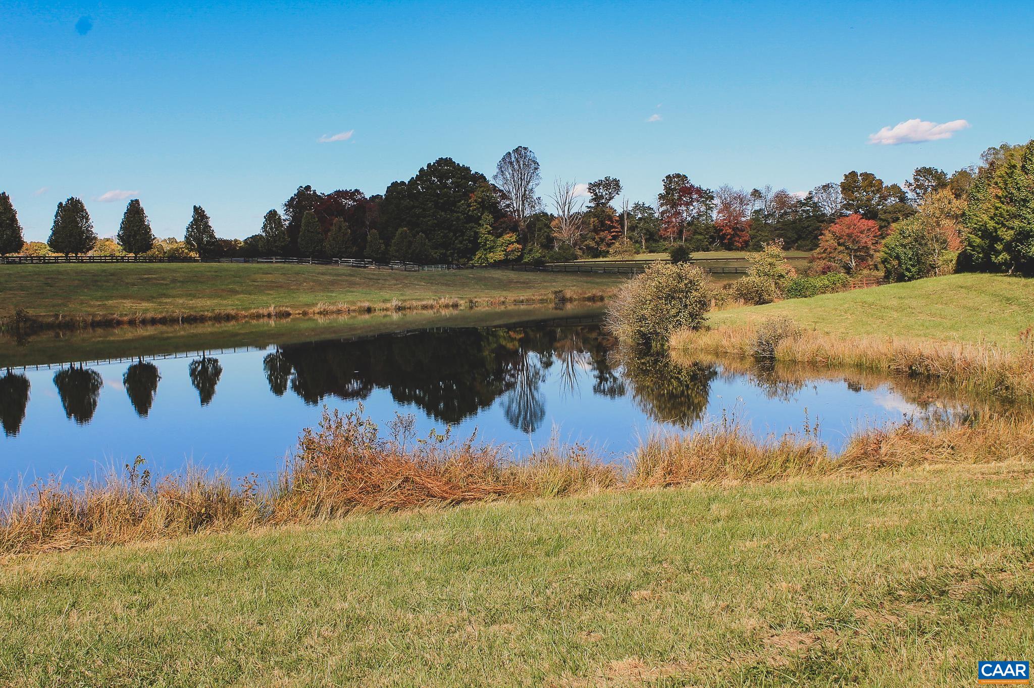 Lot 21 Rolling Road Scottsville, VA 24590 - Photo 18 of 24 a view of a lake in front of the house