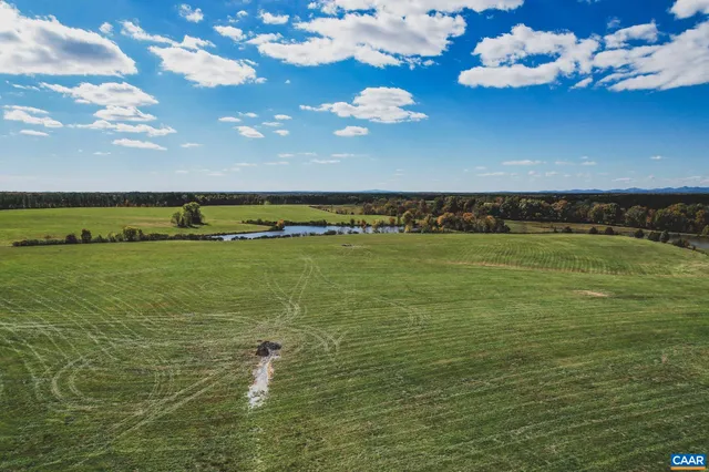 a view of a lake with a big yard