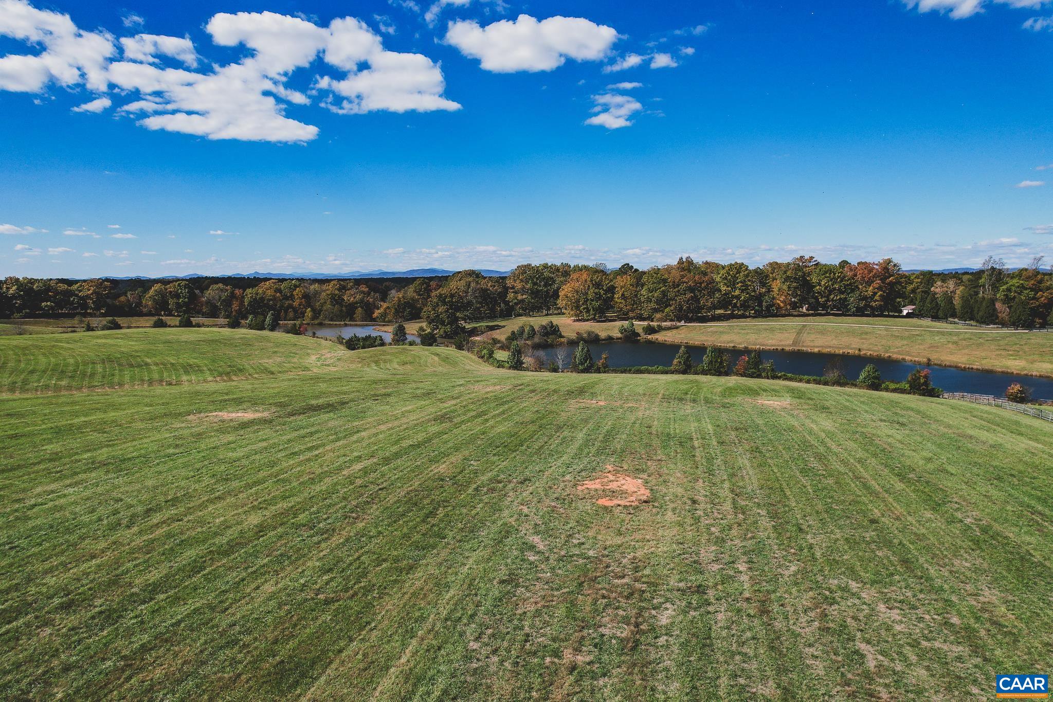 Lot 21 Rolling Road Scottsville, VA 24590 - Photo 10 of 24 a view of a lake with a big yard