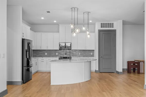 a view of kitchen with wooden floor