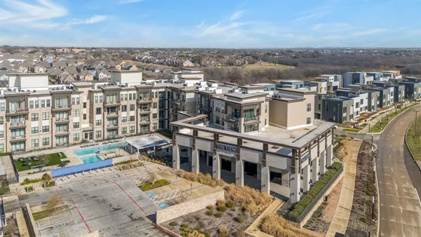 an aerial view of a house with a city view