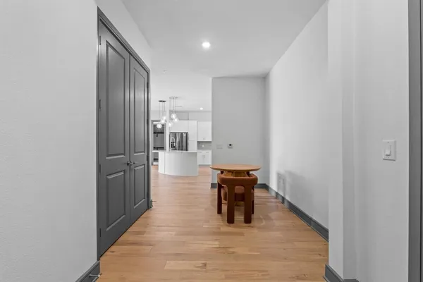 a view of kitchen with cabinets and wooden floor
