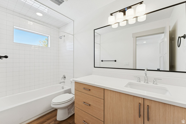254 North Main Street Bountiful, UT 84010 - Photo 18 of 45 Bathroom with shower combination, vanity, and dark wood finished floors