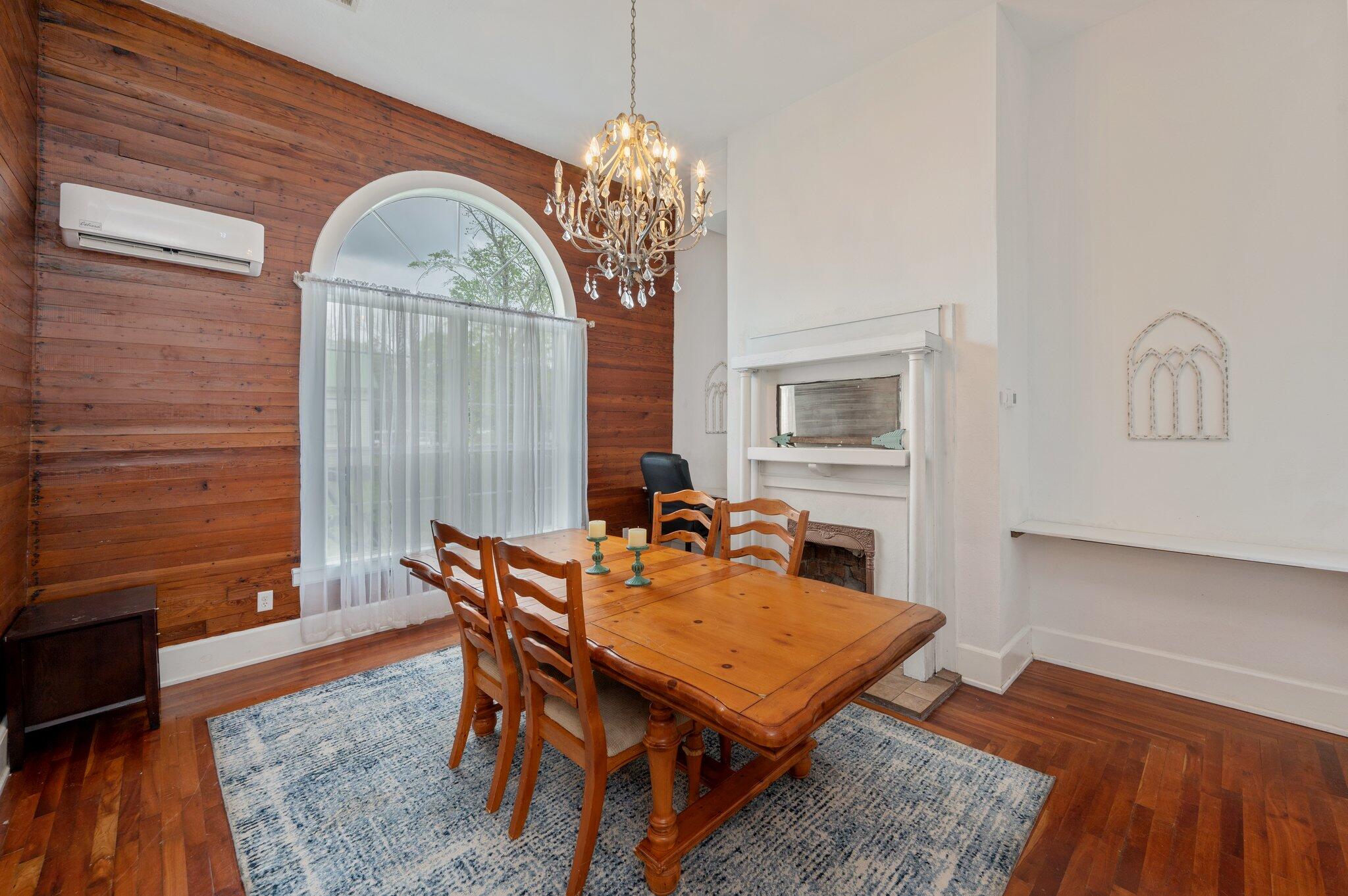 938 5th Street Florala, AL 36442 - Photo 14 of 65 a dining room with furniture a chandelier and wooden floor