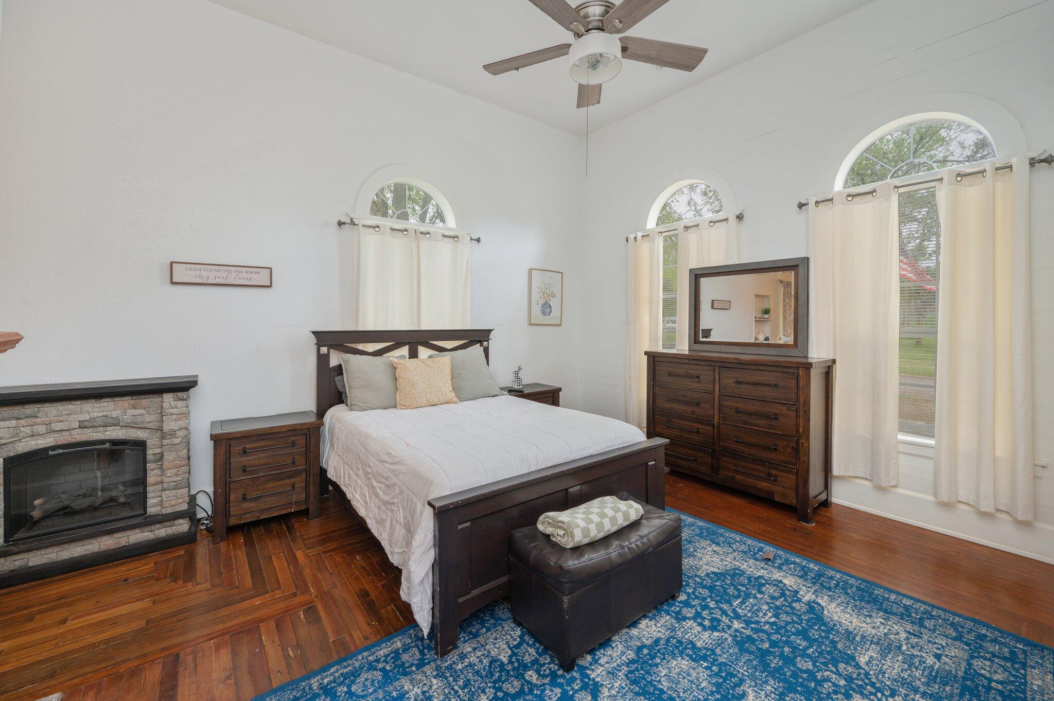 938 5th Street Florala, AL 36442 - Photo 19 of 65 a bedroom with a bed and wooden floor