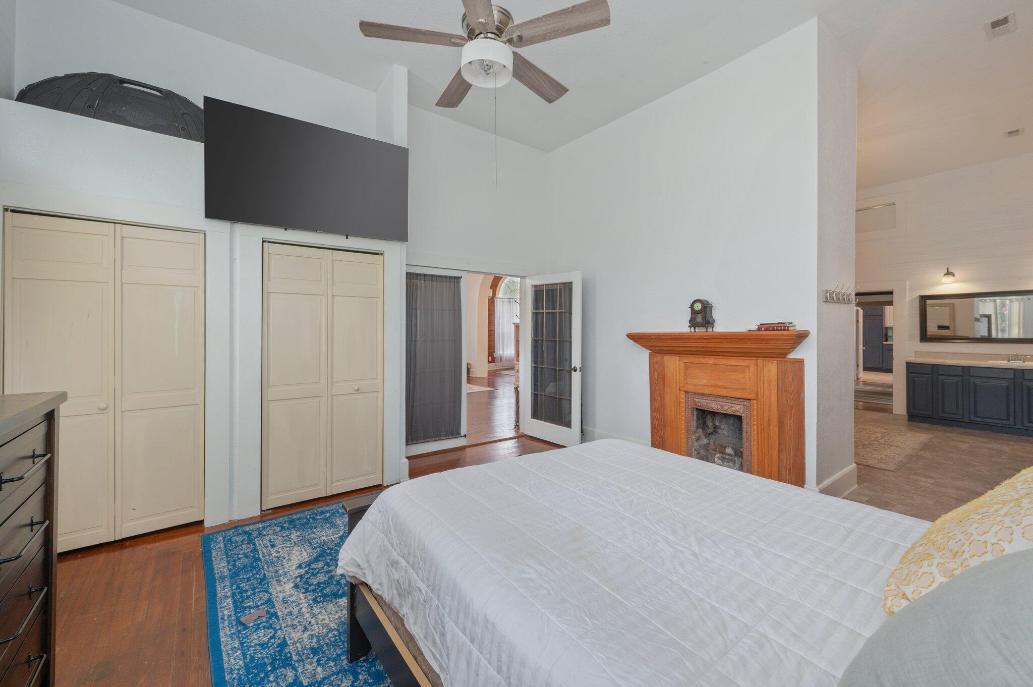 938 5th Street Florala, AL 36442 - Photo 20 of 65 a bedroom with a bed and a chandelier