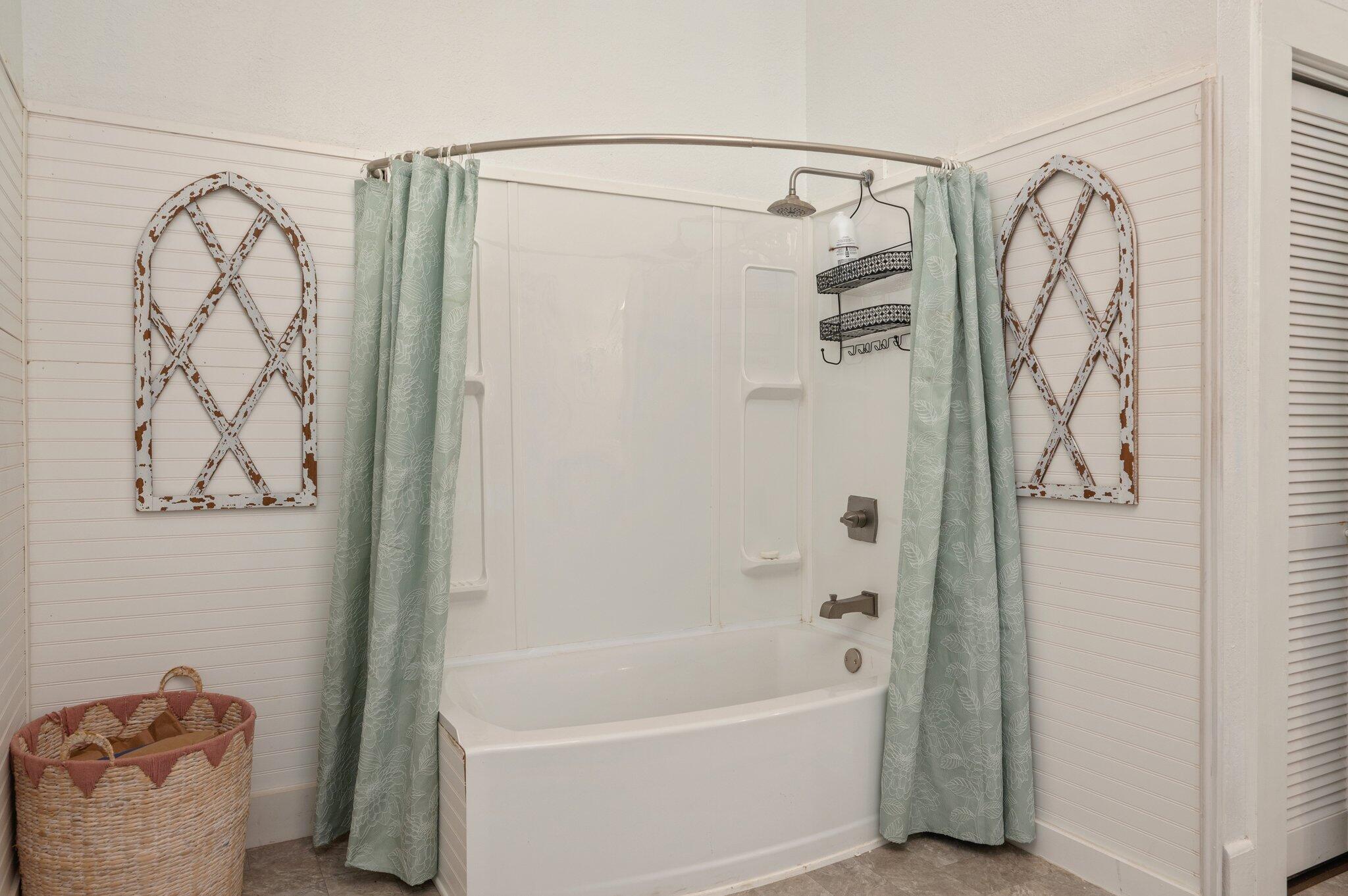938 5th Street Florala, AL 36442 - Photo 24 of 65 a bathroom with a shower curtain