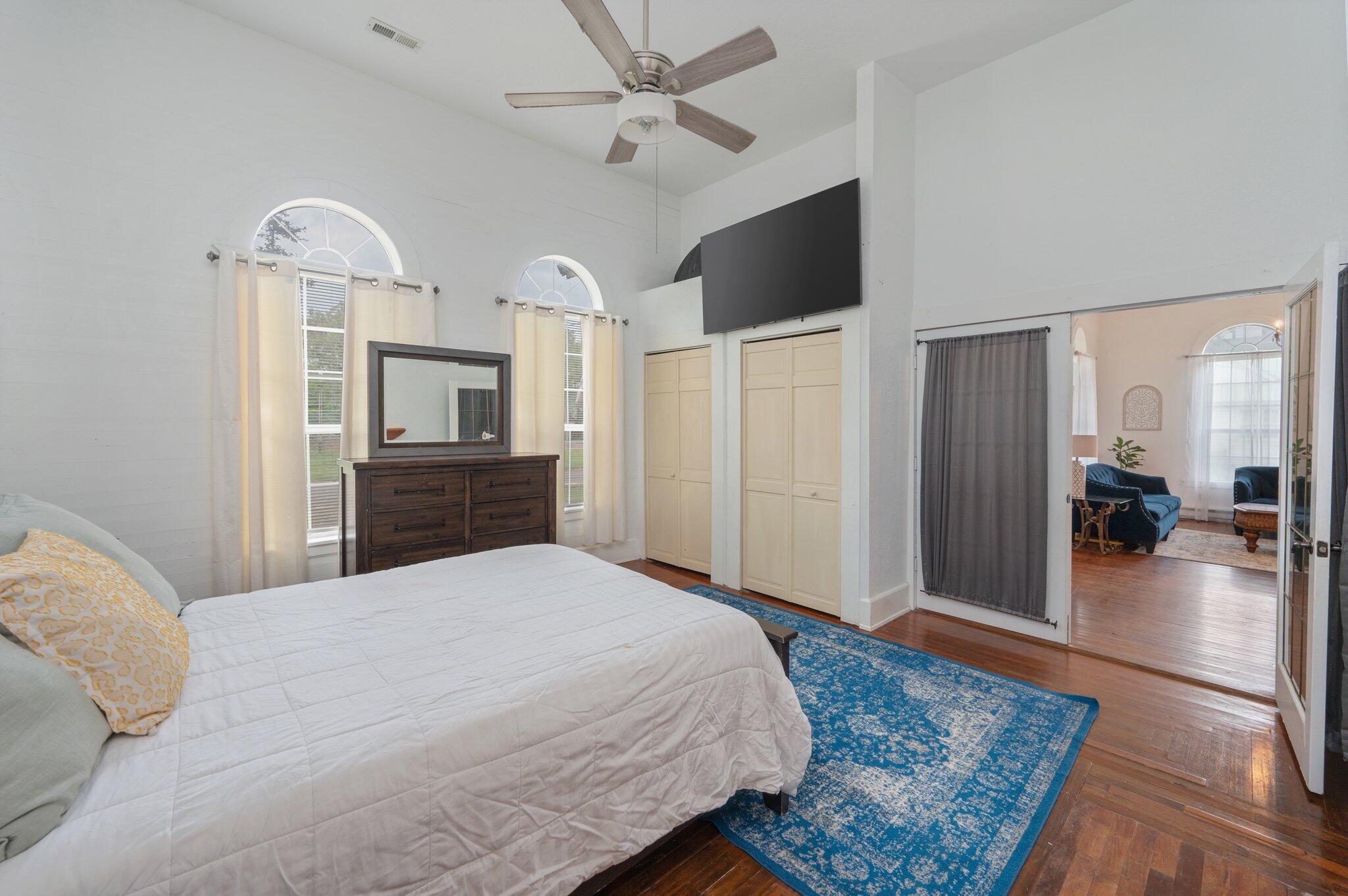 938 5th Street Florala, AL 36442 - Photo 27 of 65 a bedroom with a bed and a chandelier