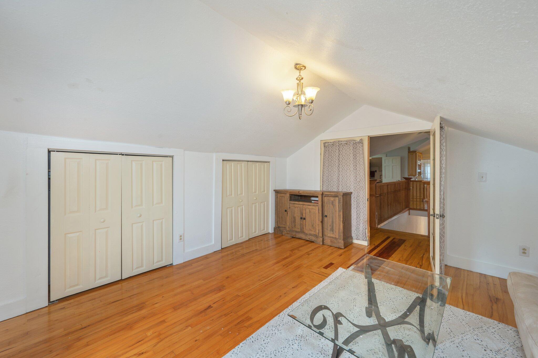 938 5th Street Florala, AL 36442 - Photo 37 of 65 a bedroom with a bed and a chandelier