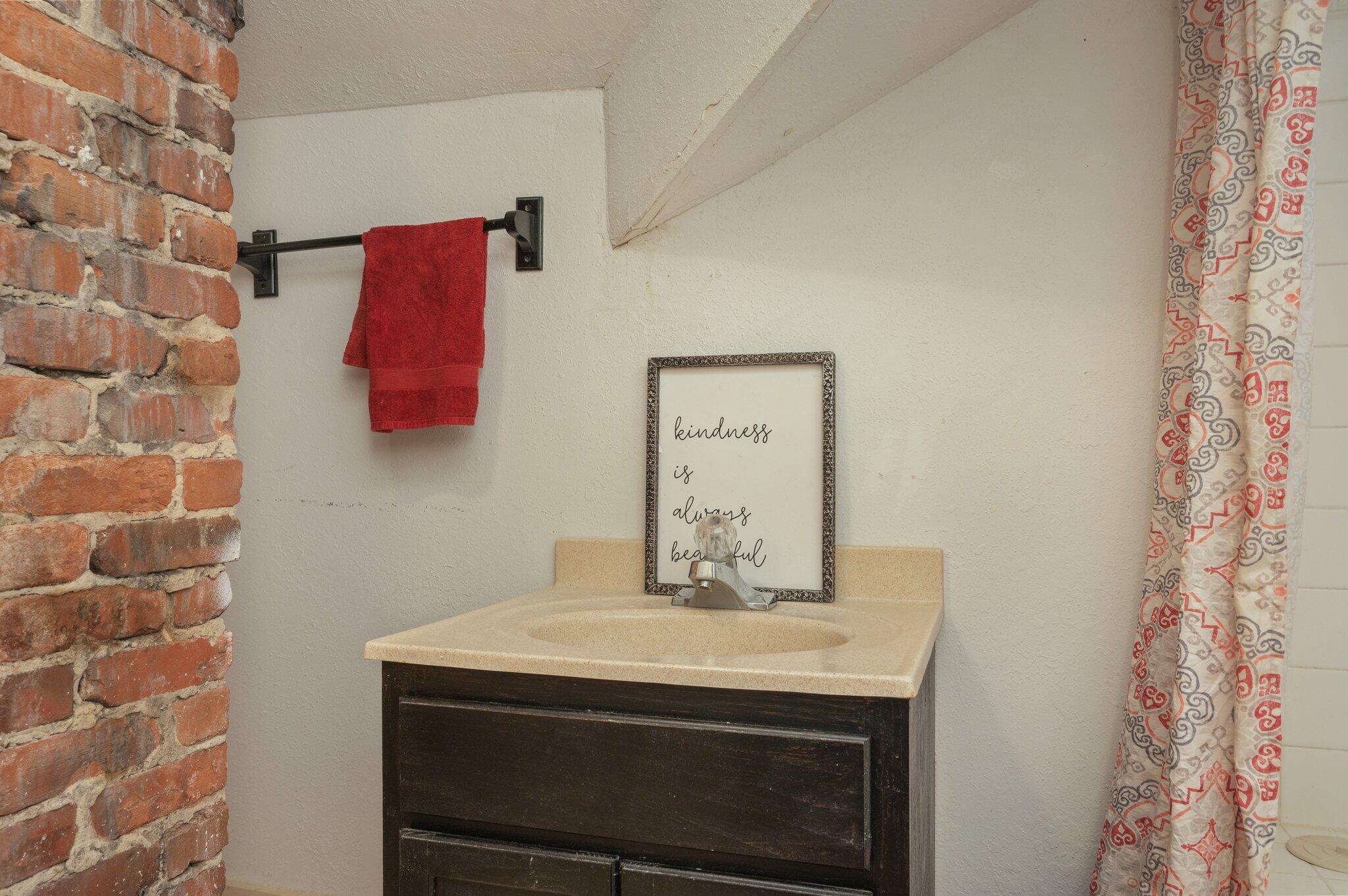 938 5th Street Florala, AL 36442 - Photo 40 of 65 a bathroom with a sink and a mirror