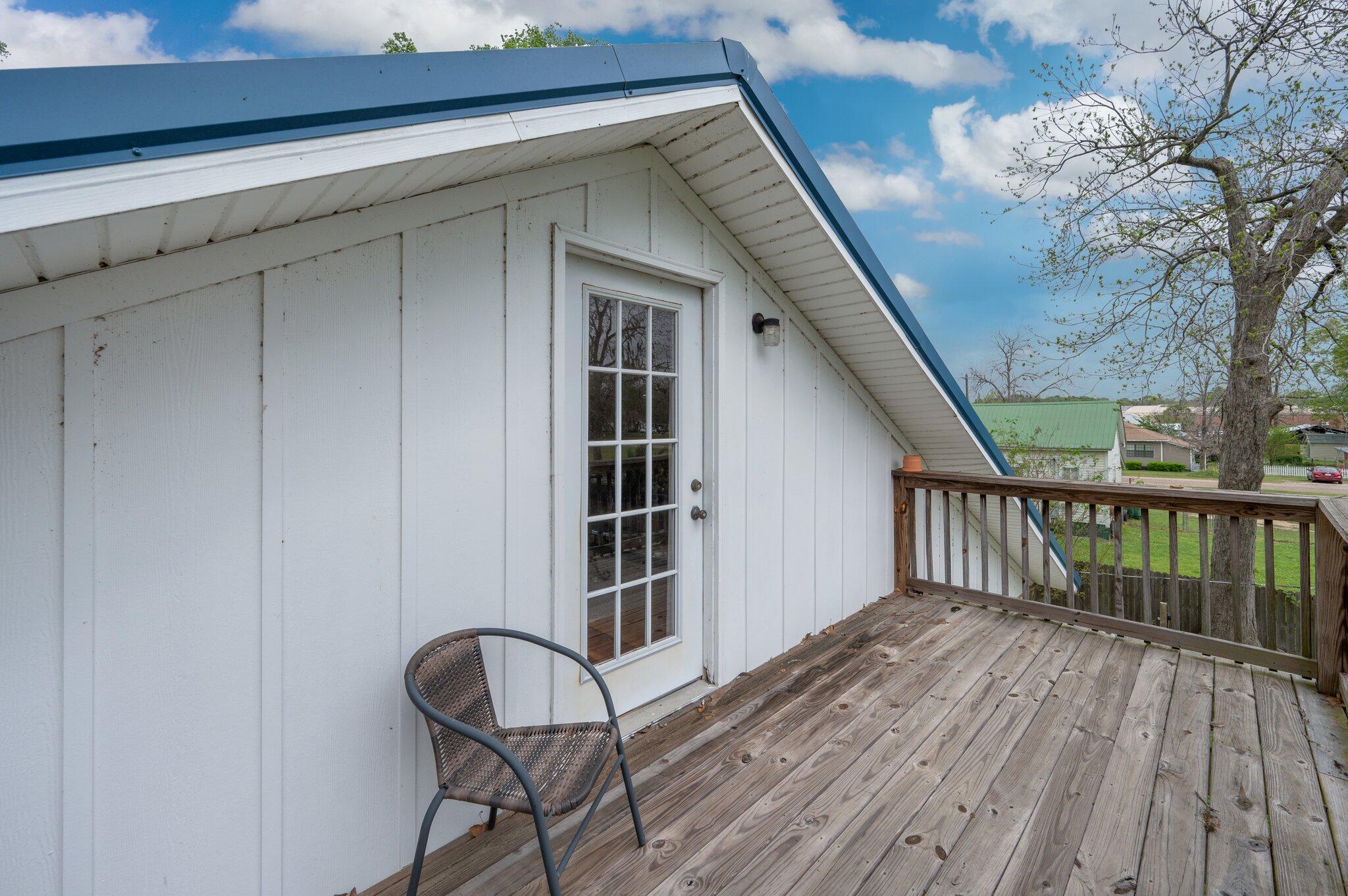 938 5th Street Florala, AL 36442 - Photo 45 of 65 a view of staircase with wooden floor and white walls