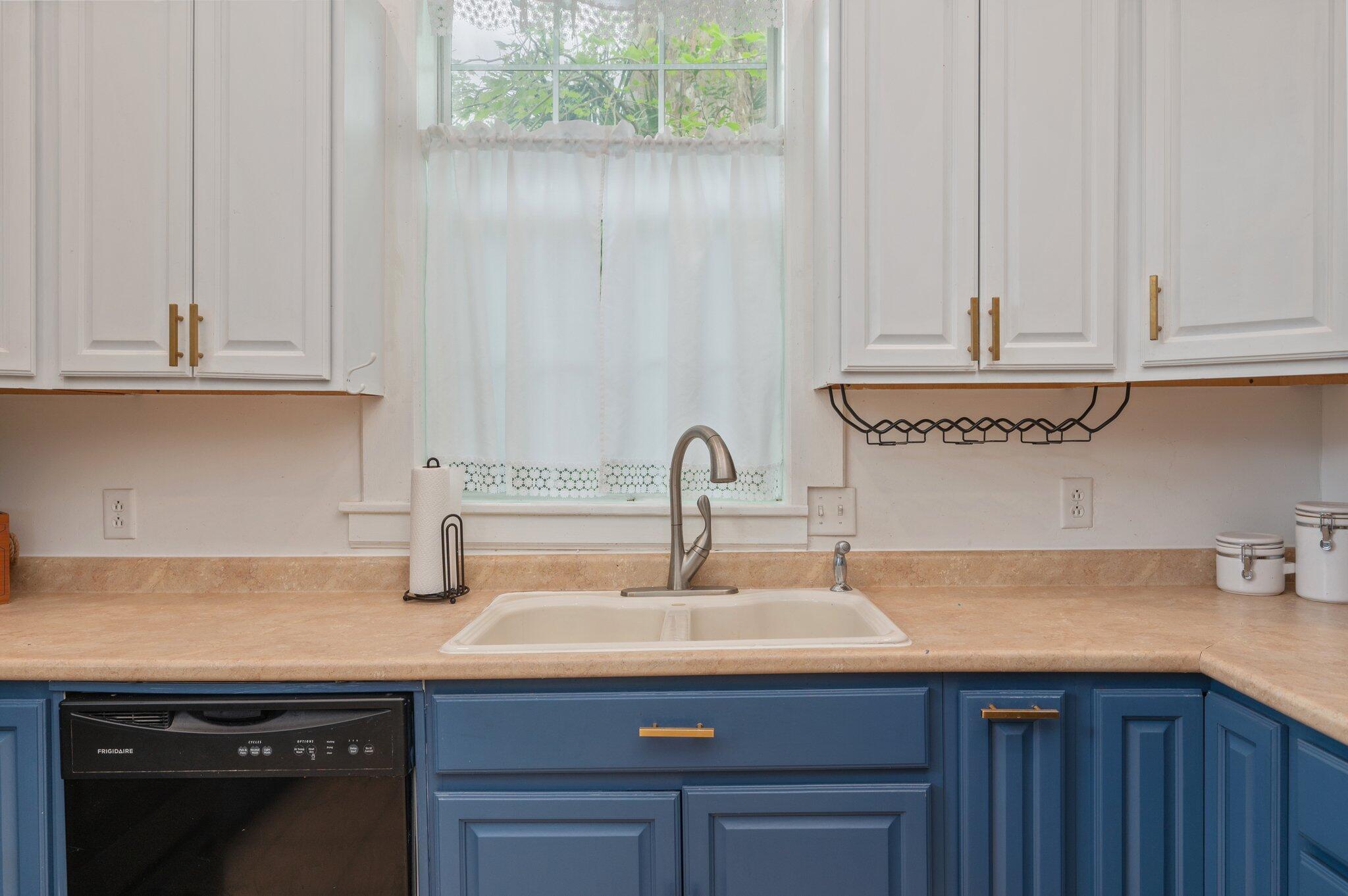938 5th Street Florala, AL 36442 - Photo 4 of 65 a kitchen with a sink and cabinets