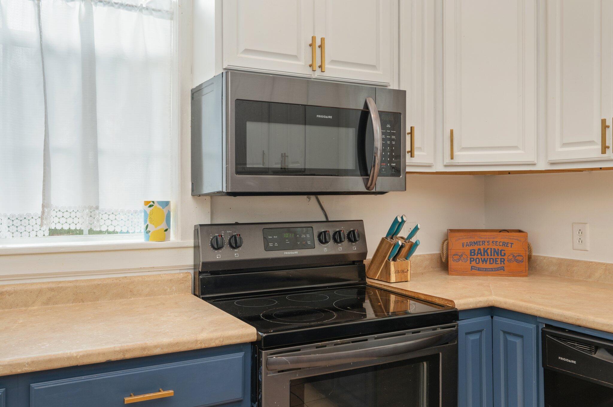 938 5th Street Florala, AL 36442 - Photo 6 of 65 a kitchen with a stove and a microwave