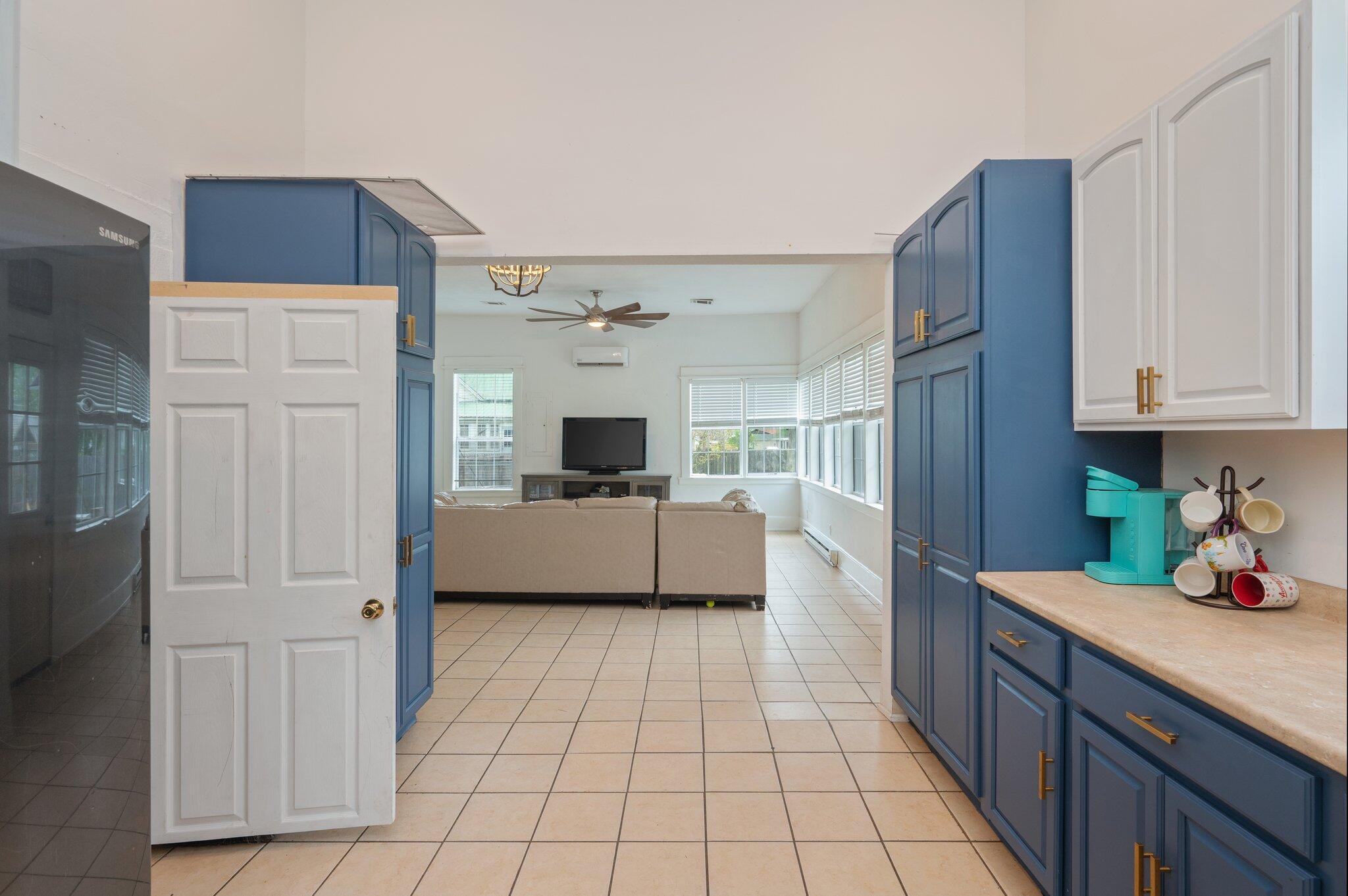 938 5th Street Florala, AL 36442 - Photo 8 of 65 a kitchen with a refrigerator sink and cabinets