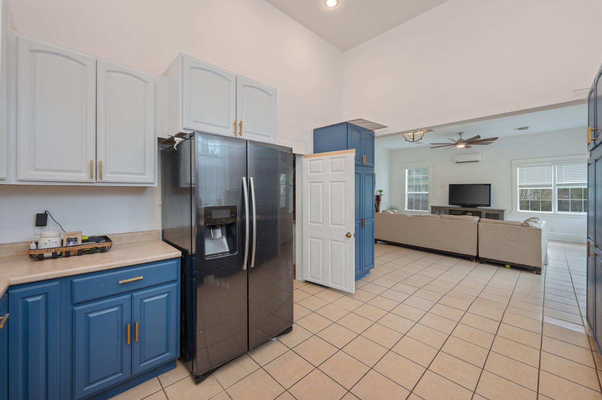 938 5th Street Florala, AL 36442 - Photo 9 of 65 a kitchen with stainless steel appliances a refrigerator sink and cabinets