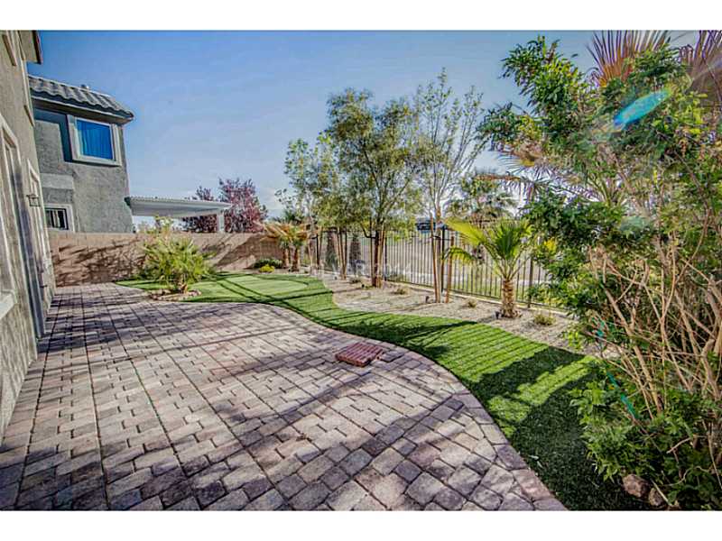 353 Foster Springs Road Las Vegas, NV 89148 - Photo 30 of 35 Yard/Garden. Rear yard overlooking Rhodes Ranch Championship Golf Course~