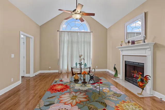 a living room with furniture and a fireplace