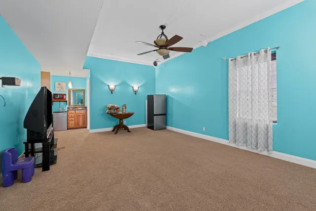 a view of a hallway with closet and wooden floor