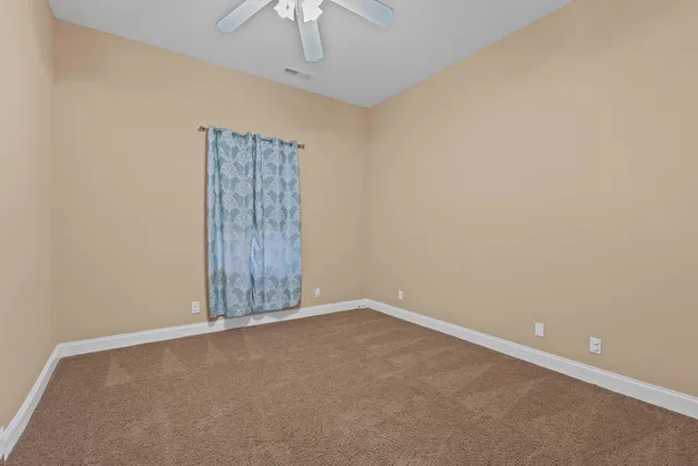 a room with wooden furniture and air hockey table