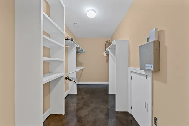 a view of a brick house with a large window