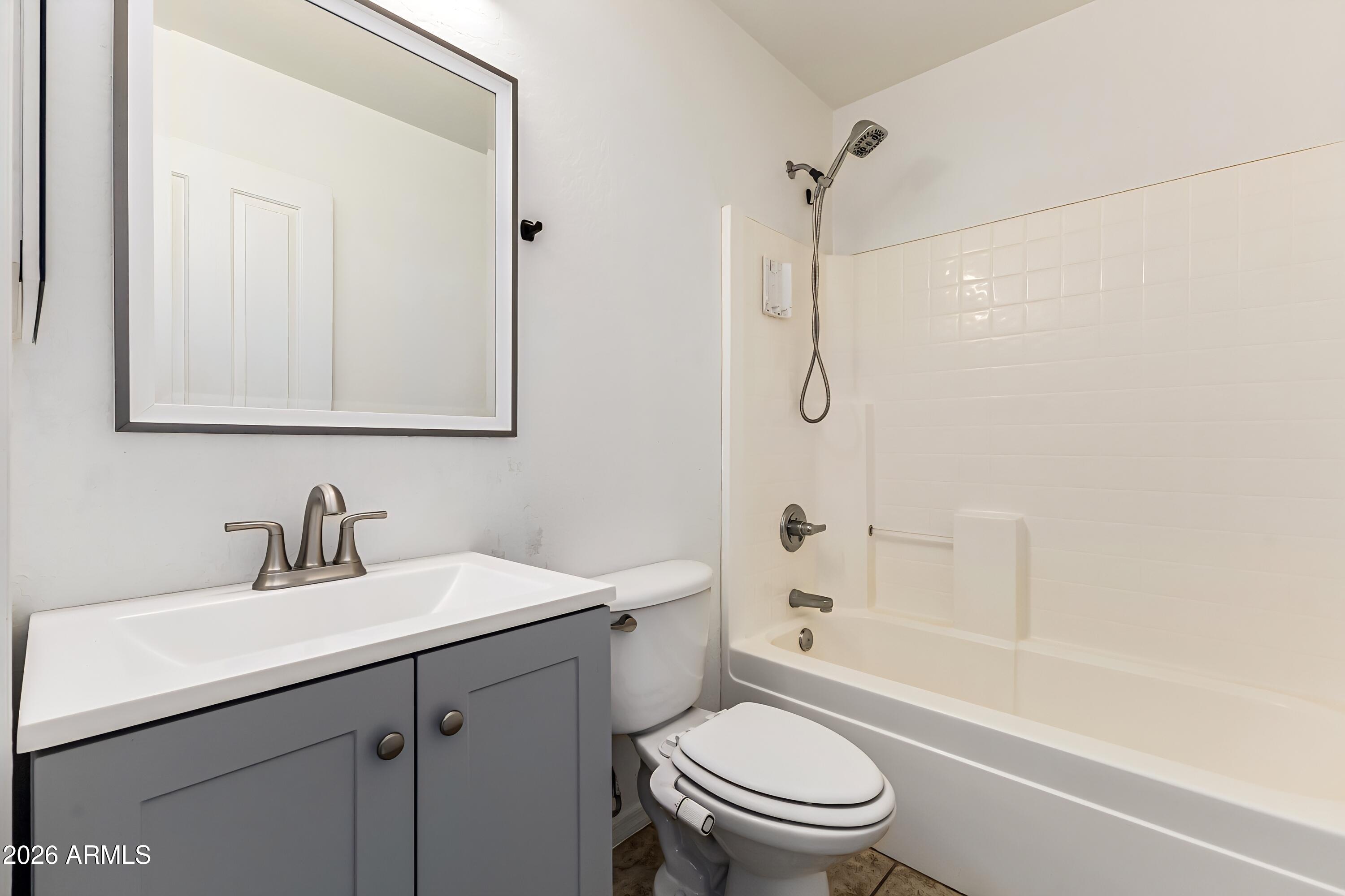 4208 South Sawmill Road Gilbert, AZ 85297 - Photo 41 of 46 a bathroom with a sink toilet and shower
