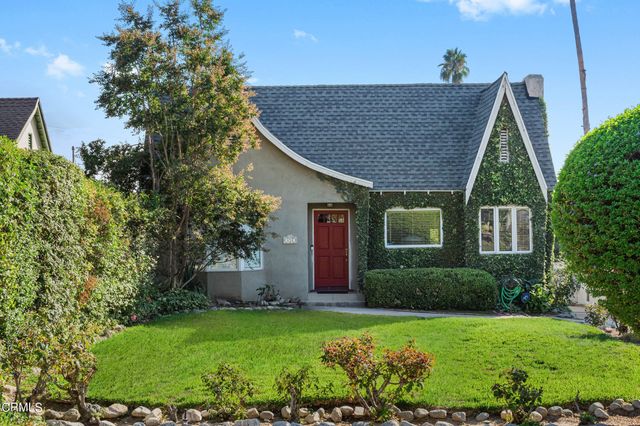 a aerial view of a house with a yard