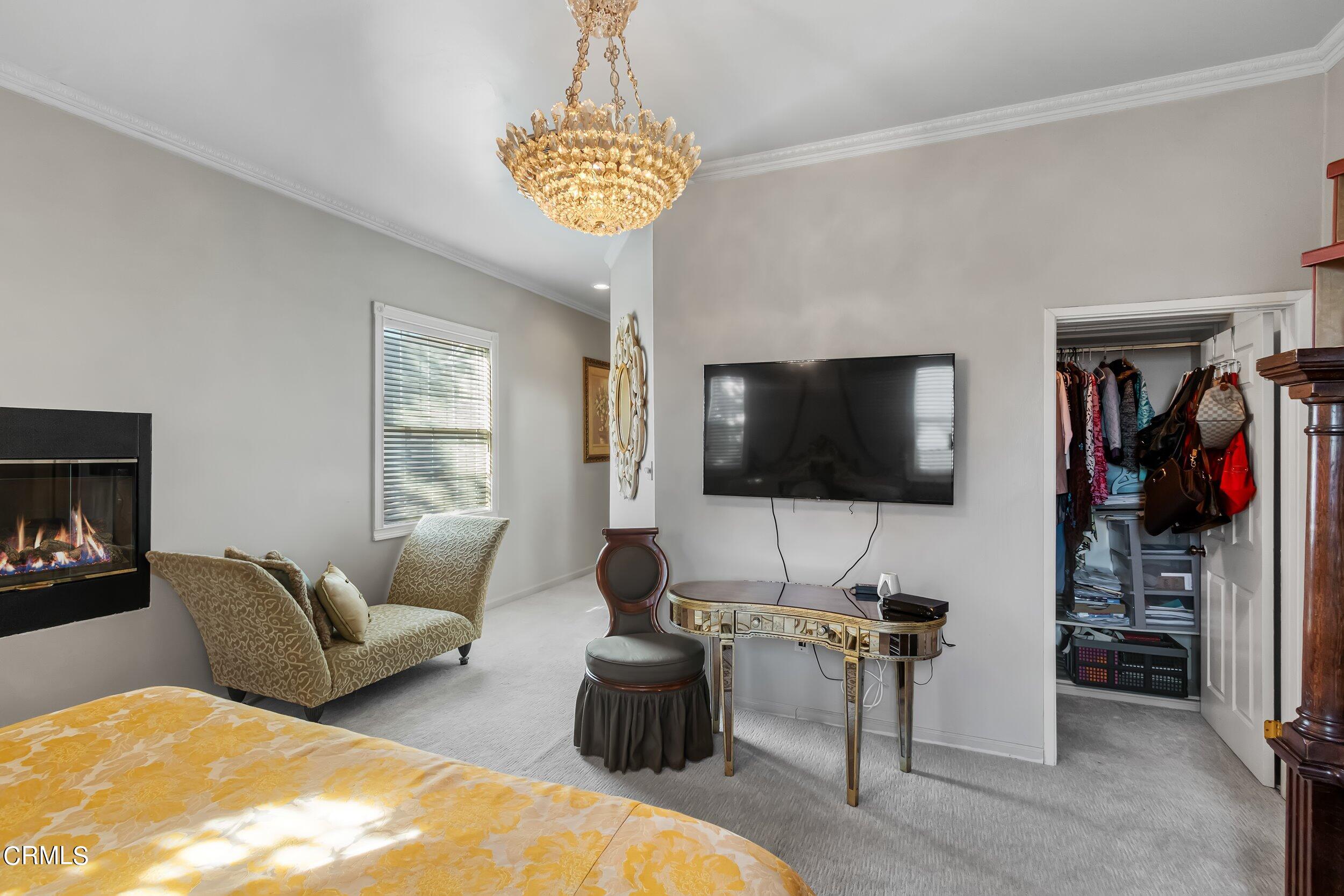 432 West Poppyfields Drive Altadena, CA 91001 - Photo 13 of 23 a living room with furniture and a flat screen tv