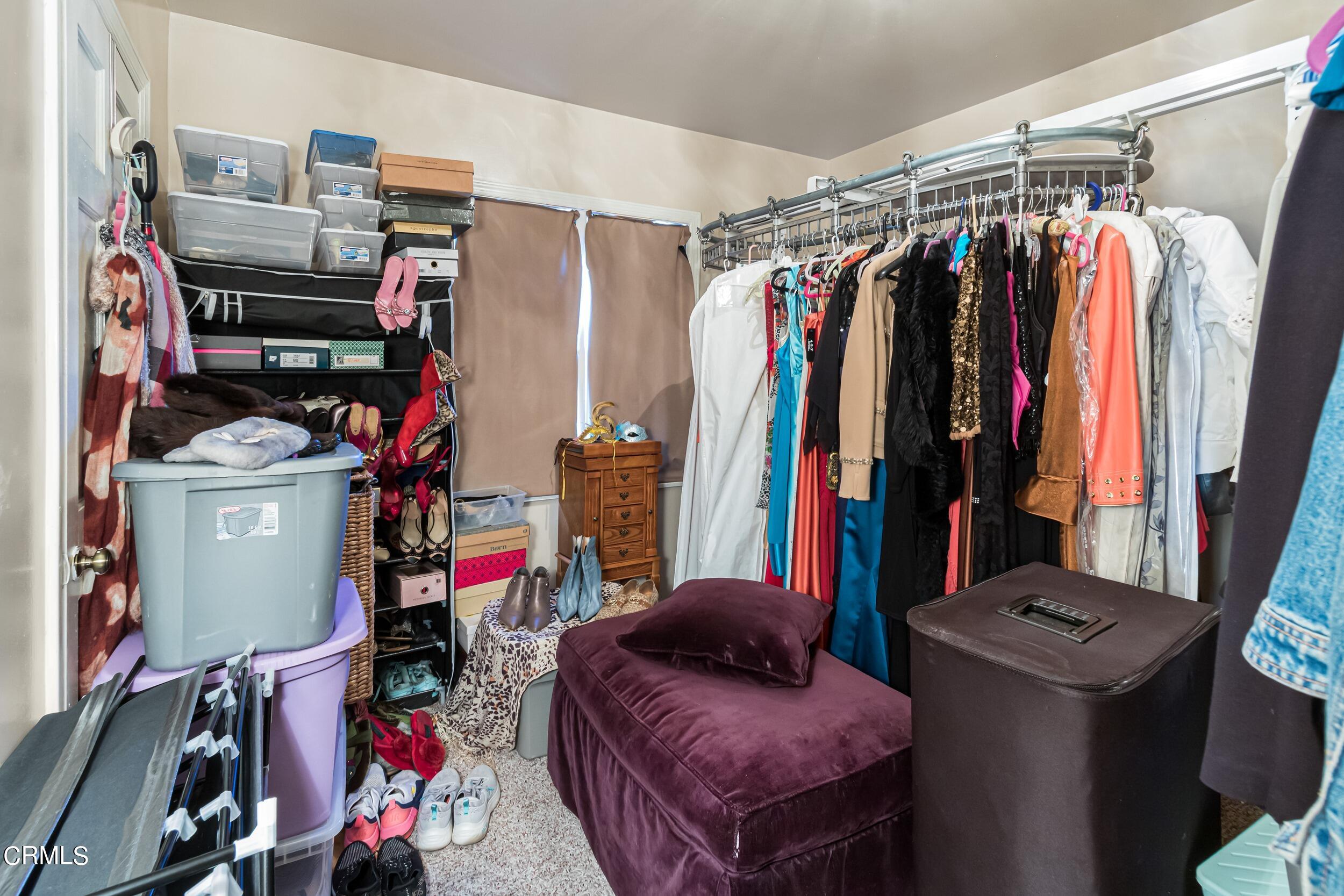 432 West Poppyfields Drive Altadena, CA 91001 - Photo 15 of 23 a view of walk in closet with clothes and shoes