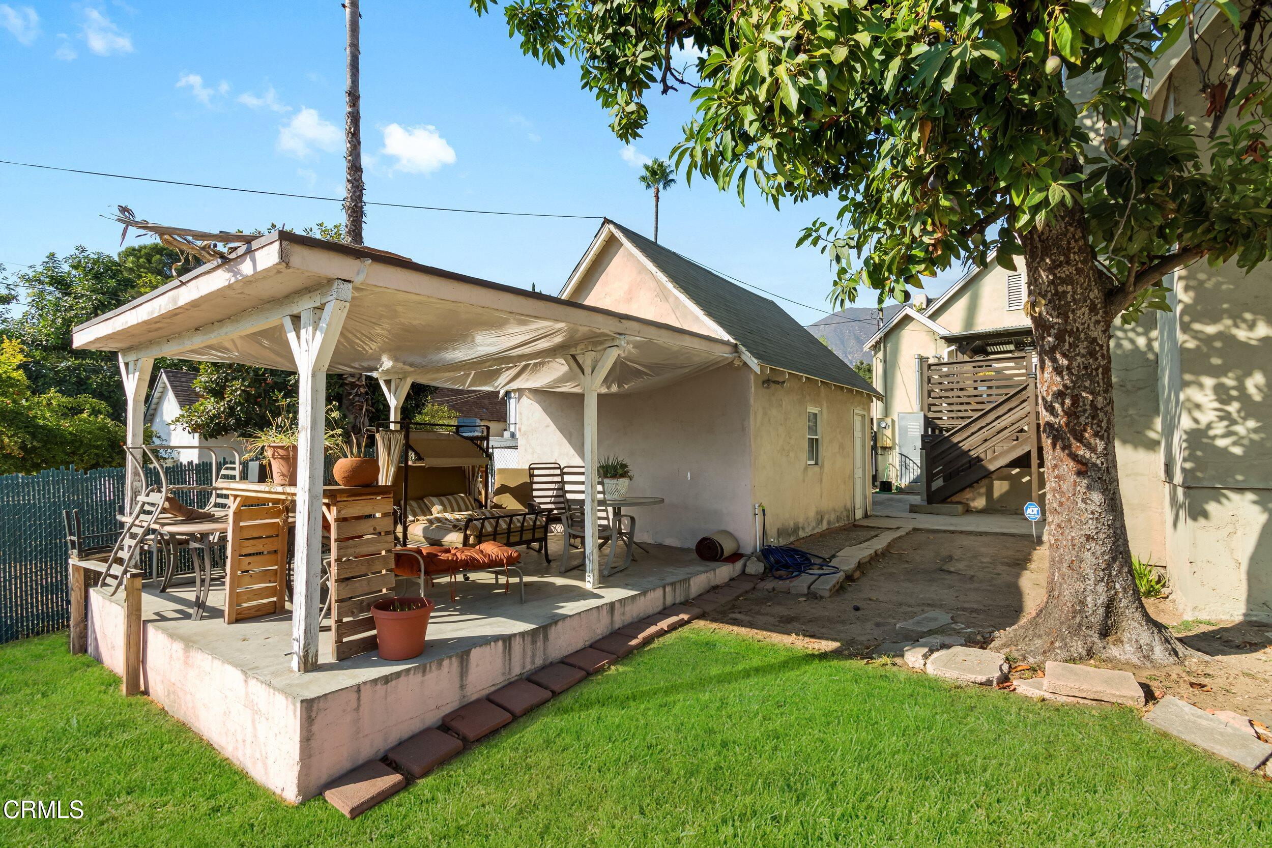 432 West Poppyfields Drive Altadena, CA 91001 - Photo 20 of 23 a view of a house with backyard porch and sitting area