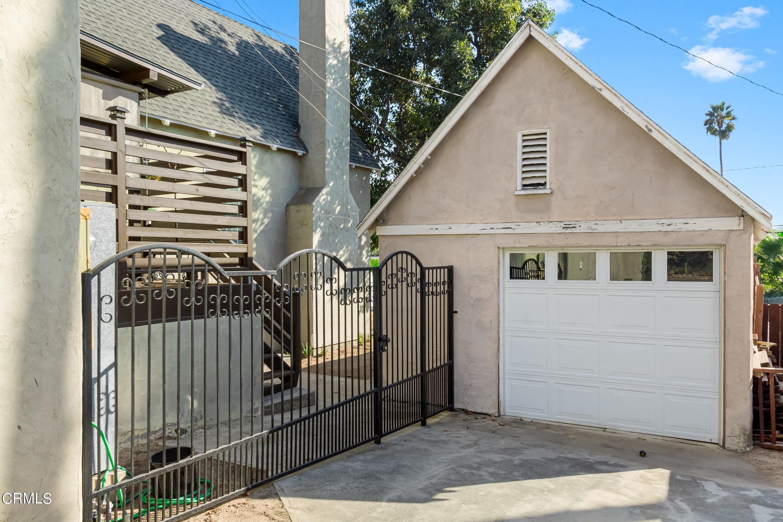 432 West Poppyfields Drive Altadena, CA 91001 - Photo 21 of 23 a view of a house with a iron gate