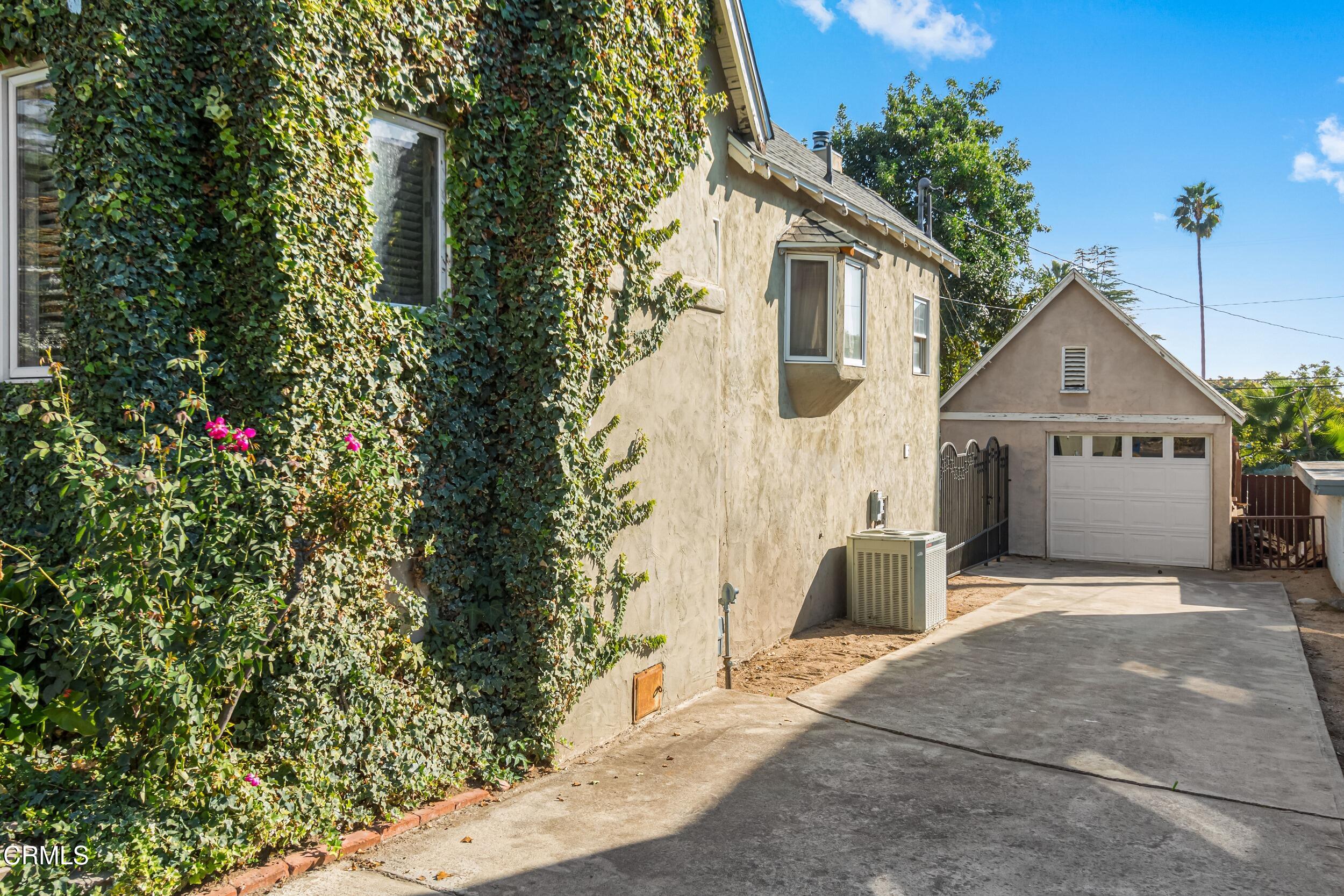 432 West Poppyfields Drive Altadena, CA 91001 - Photo 22 of 23 a front view of a house with a garden