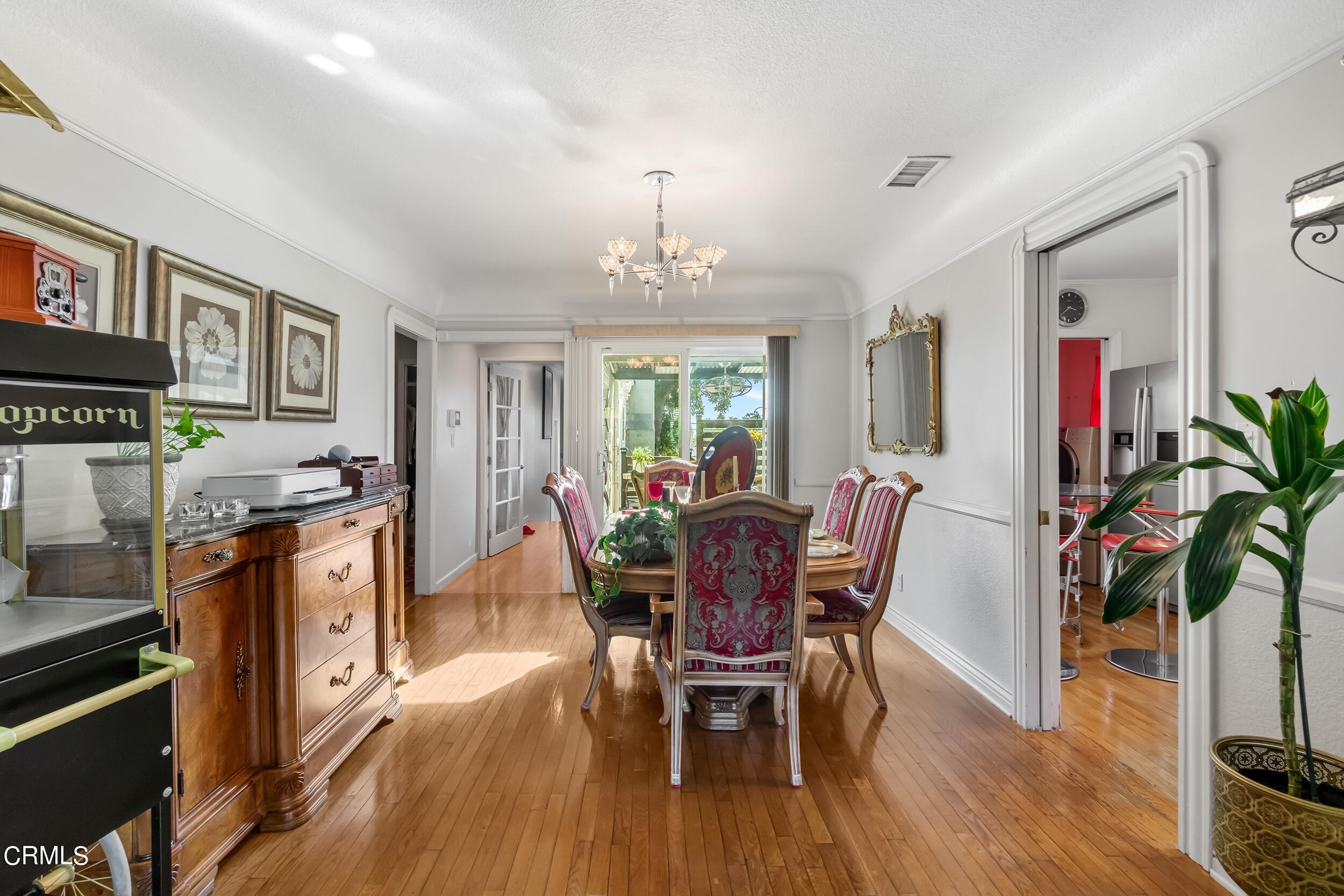 432 West Poppyfields Drive Altadena, CA 91001 - Photo 4 of 23 a view of a dining room with furniture window and wooden floor