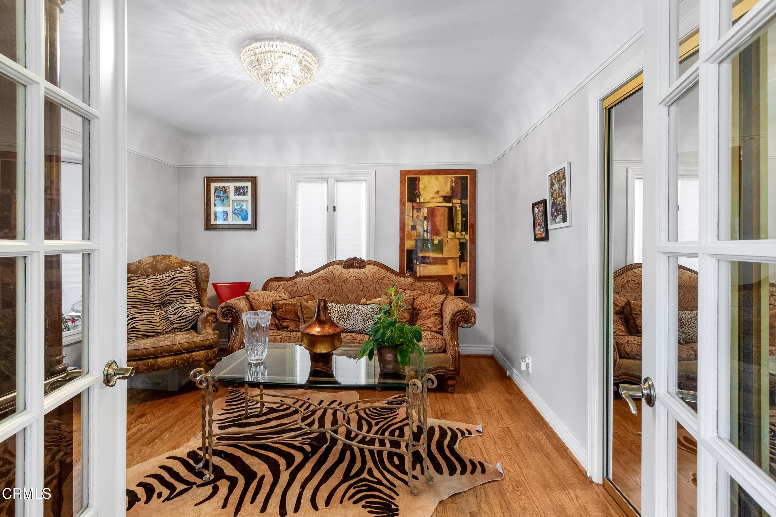 432 West Poppyfields Drive Altadena, CA 91001 - Photo 8 of 23 a bedroom with furniture and a window