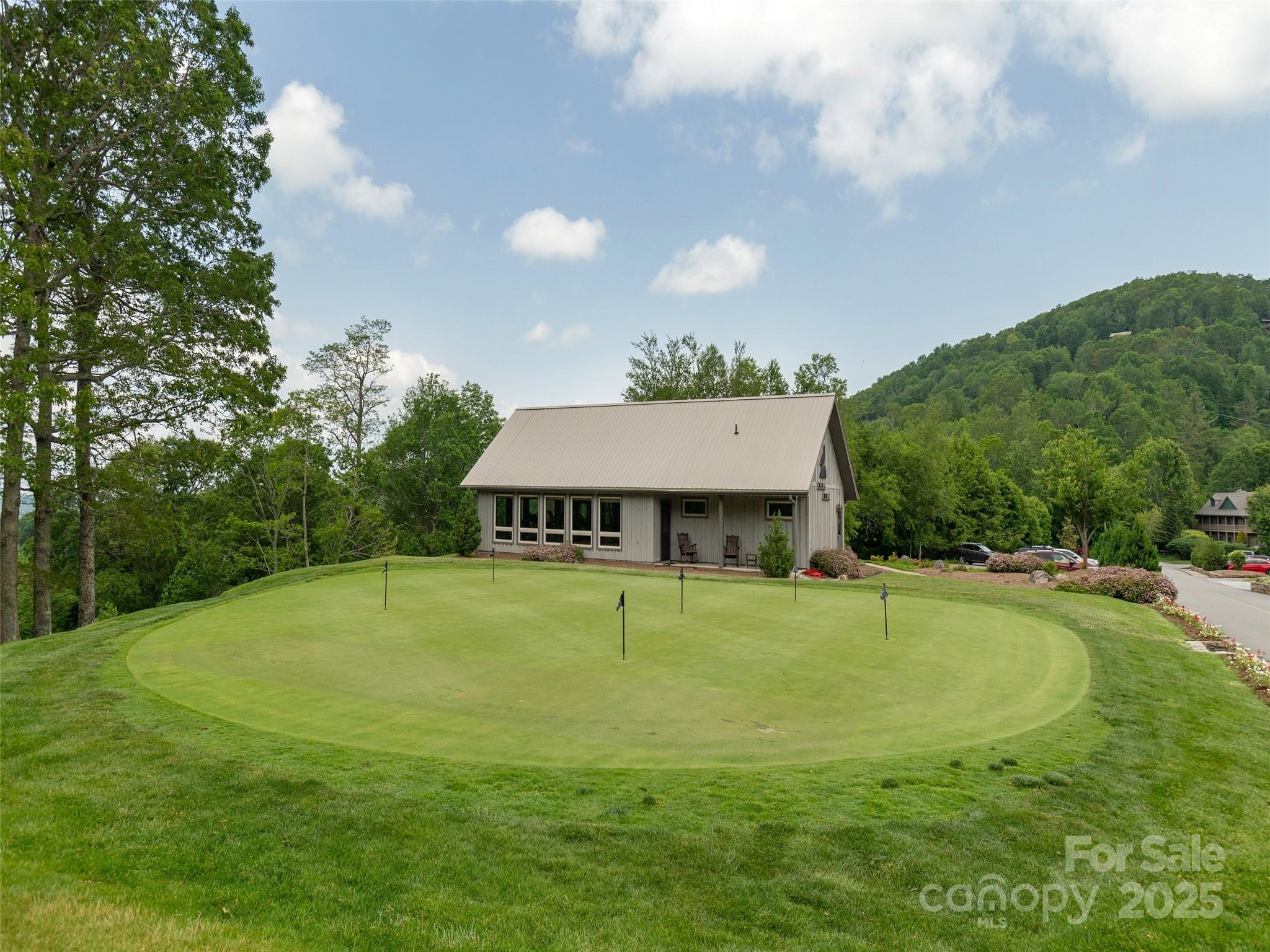 0 English Ridge Drive, Unit 34 Mars Hill, NC 28754 - Photo 11 of 32 a view of a house with a backyard and basketball court