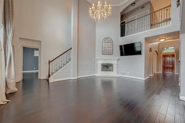 a view of an entryway with wooden floor