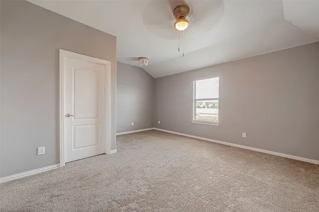 an empty room with a empty space and a window