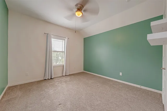 an empty room with a empty space and window