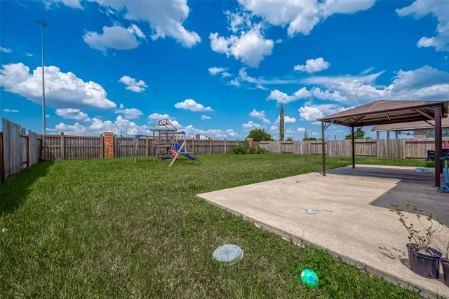 a view of a house with a yard porch and sitting area