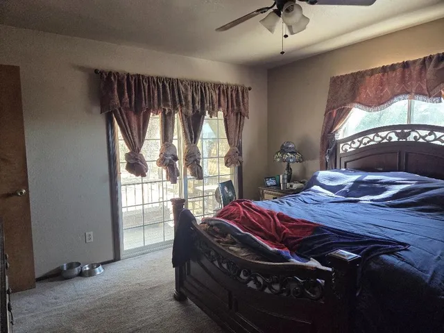 a bed sitting in a room next to a window