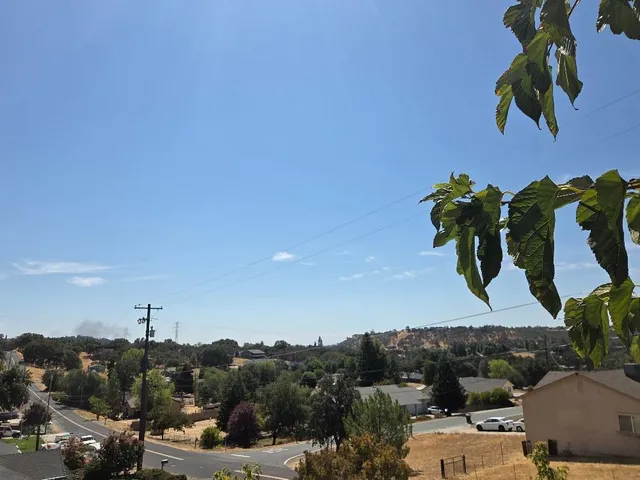 a front view of a house with a bench