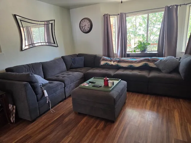 a living room with furniture and a window
