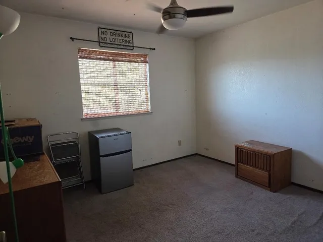 a view of workspace with furniture and window