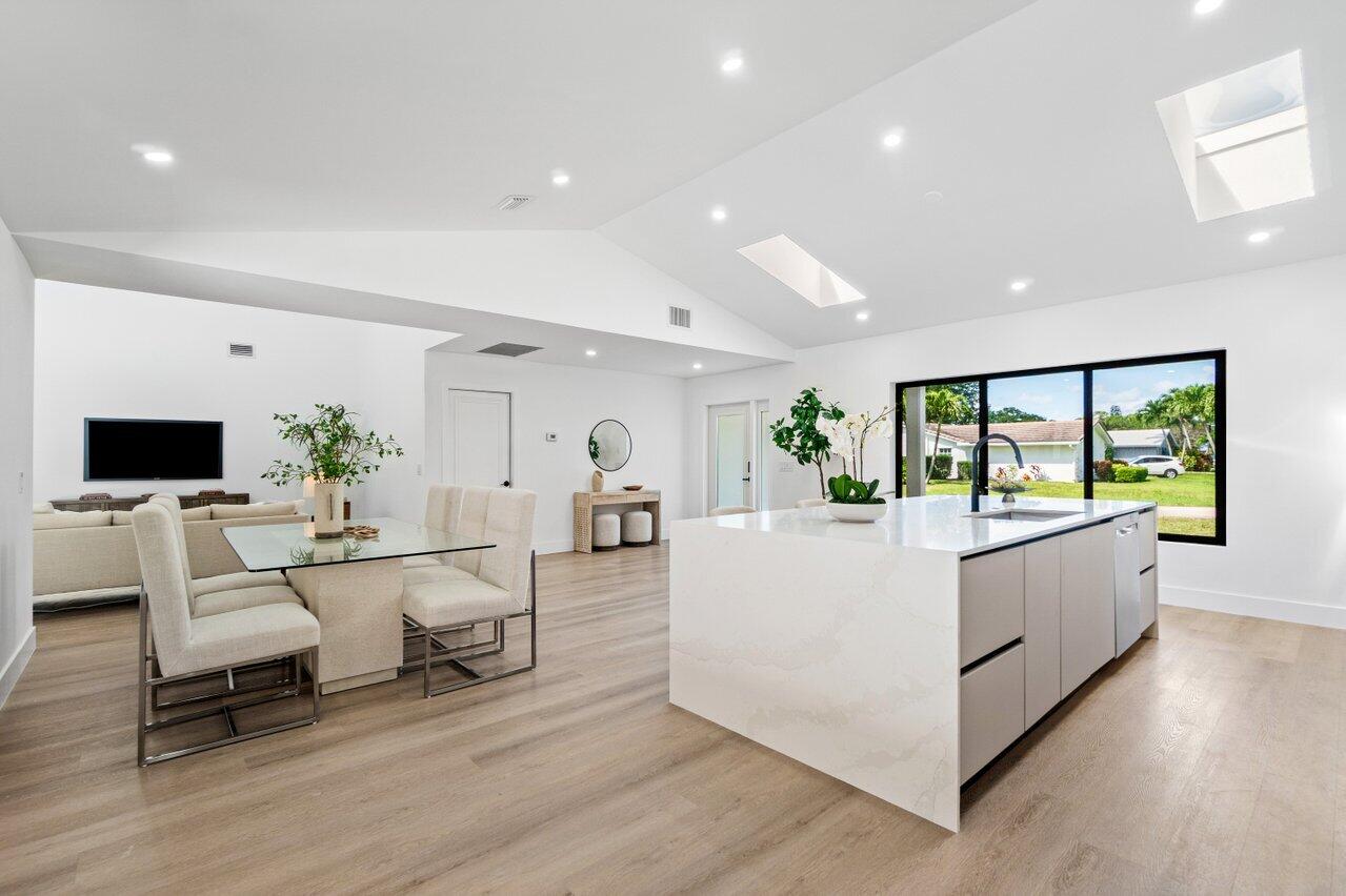 4408 Nicole Circle Tequesta, FL 33469 - Photo 11 of 29 a living room with furniture and a flat screen tv