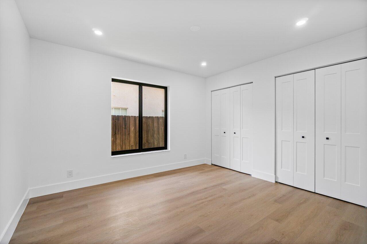 4408 Nicole Circle Tequesta, FL 33469 - Photo 23 of 29 a view of an empty room with a window and a dresser