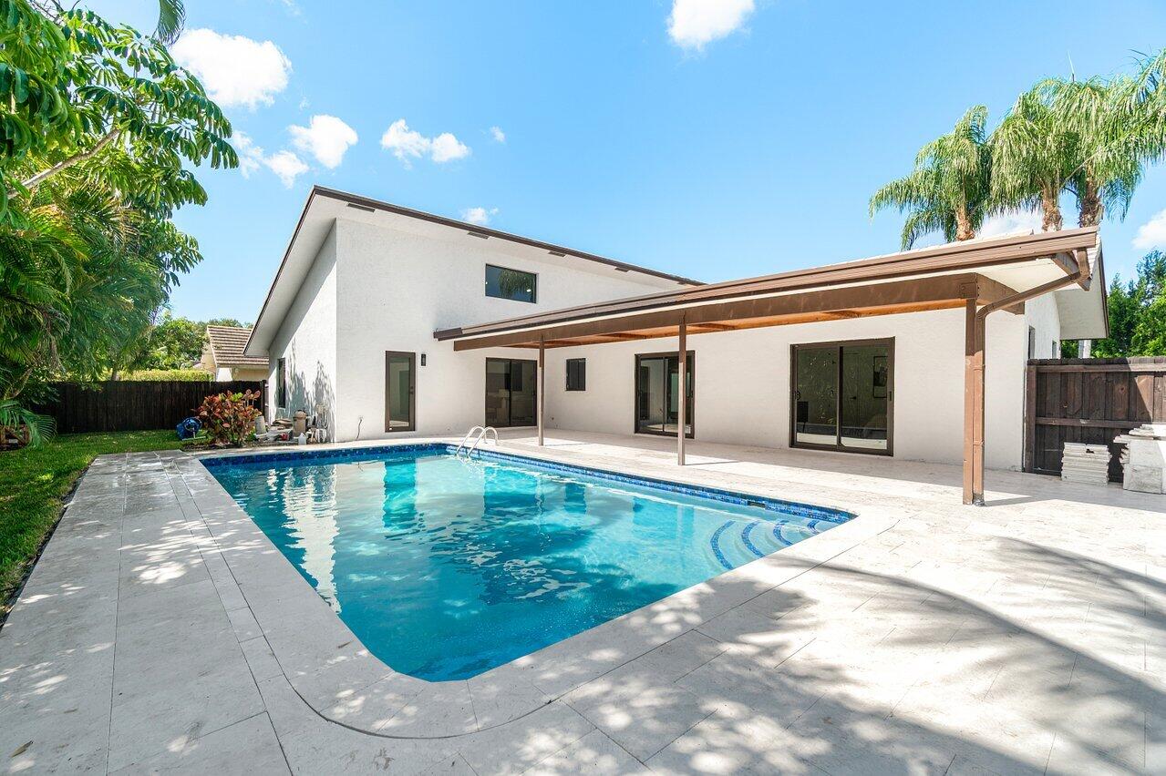 4408 Nicole Circle Tequesta, FL 33469 - Photo 28 of 29 a view of a house with backyard