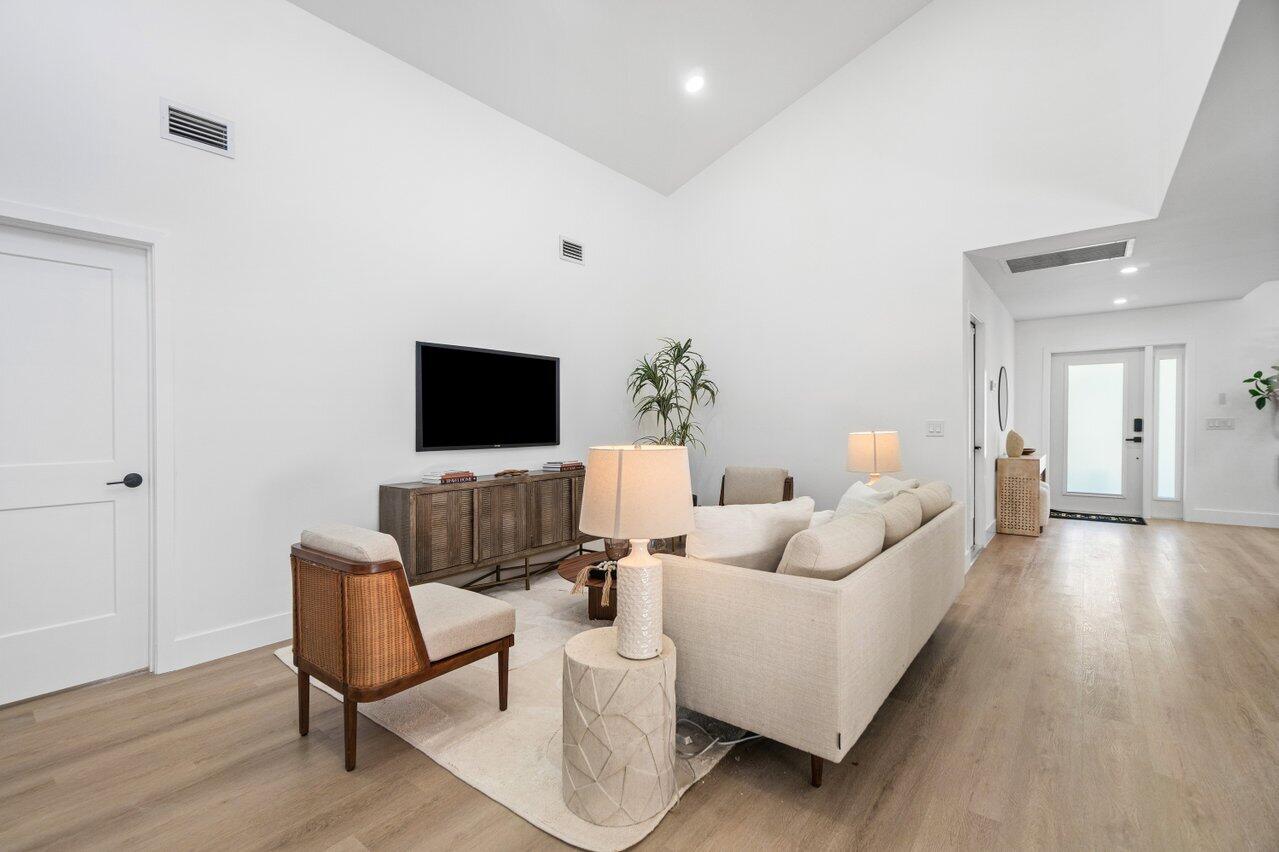 4408 Nicole Circle Tequesta, FL 33469 - Photo 6 of 29 a living room with furniture and a flat screen tv