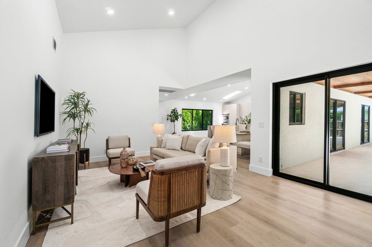 4408 Nicole Circle Tequesta, FL 33469 - Photo 7 of 29 a living room with furniture and a flat screen tv