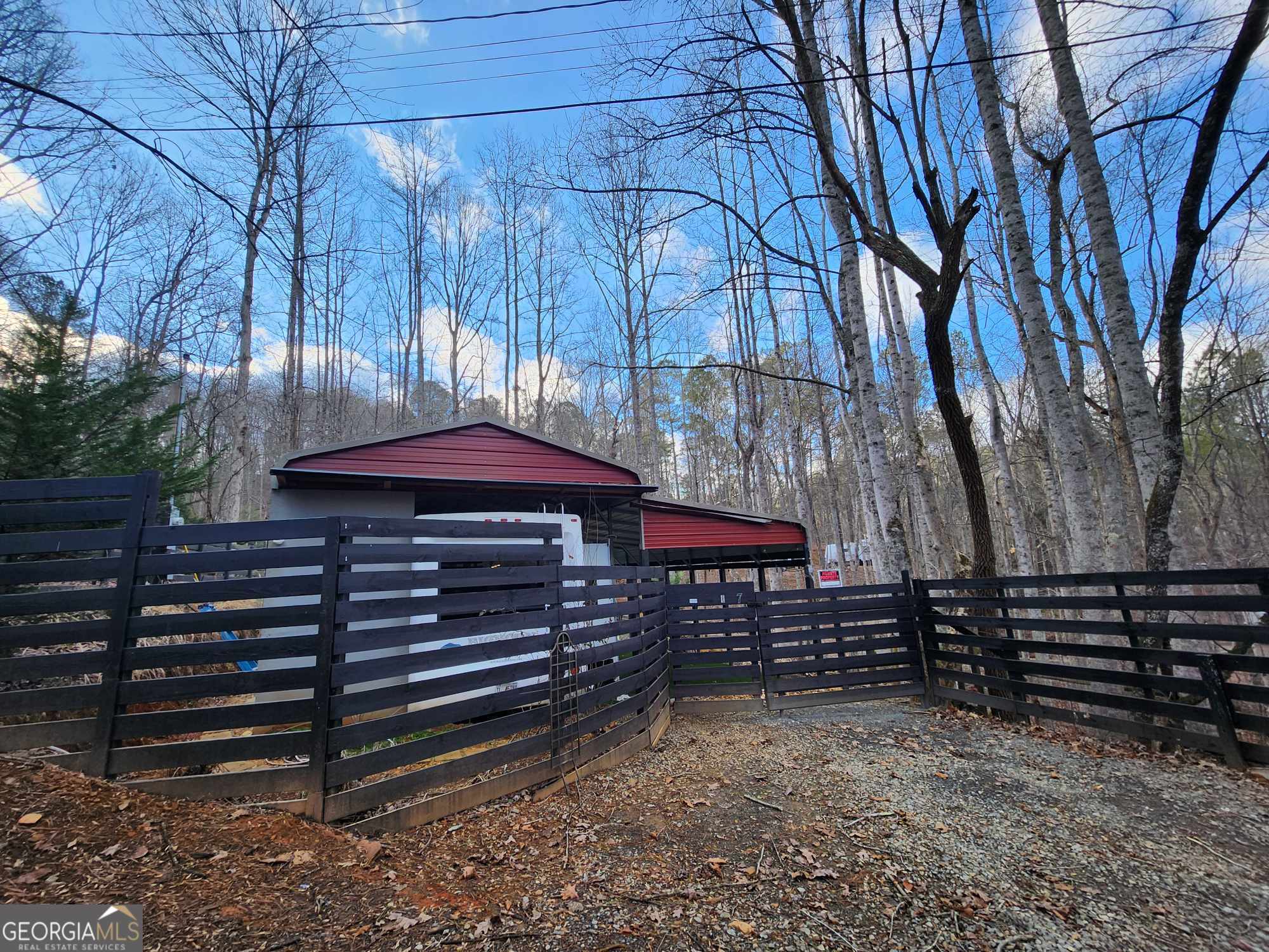 7 35th Street Ellijay, GA 30540 - Photo 1 of 1 a wooden bench sitting in front of a building