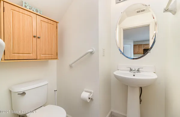 a view of walk in closet and empty room