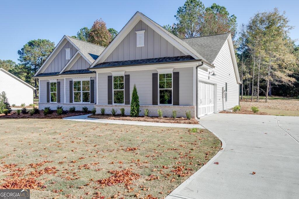2119 Nunnally Farm Road, Unit 5 Monroe, GA 30655 - Photo 1 of 1 a front view of a house with a yard